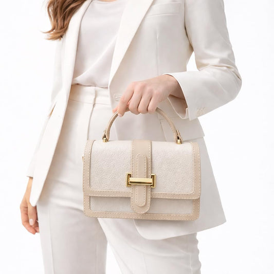 Red leather women’s handbag with a distinctive design, featuring a gold metal buckle and a top handle — suitable for work and special occasions.