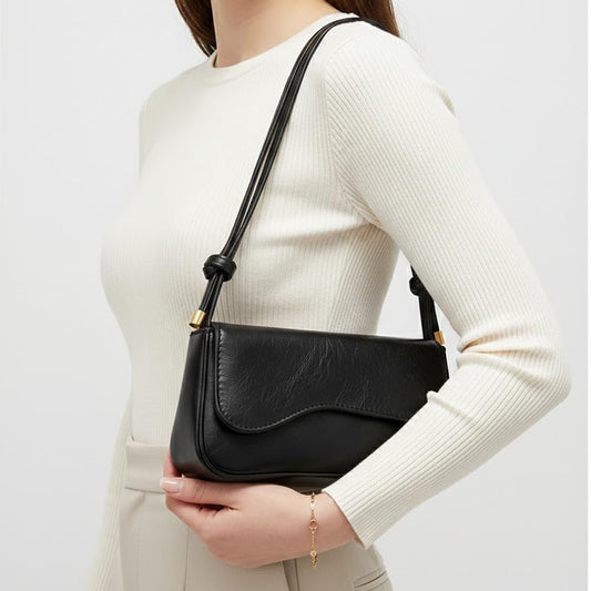 Small Cafe leather women’s handbag with a modern design and a long strap – suitable for evening events and everyday outings.