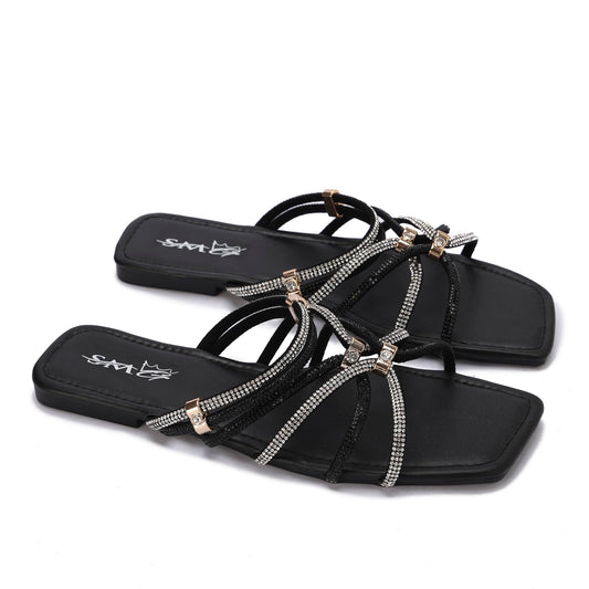 Stylish women's slippers with sparkling rhinestones and a flat heel - equipped with a comfortable sole