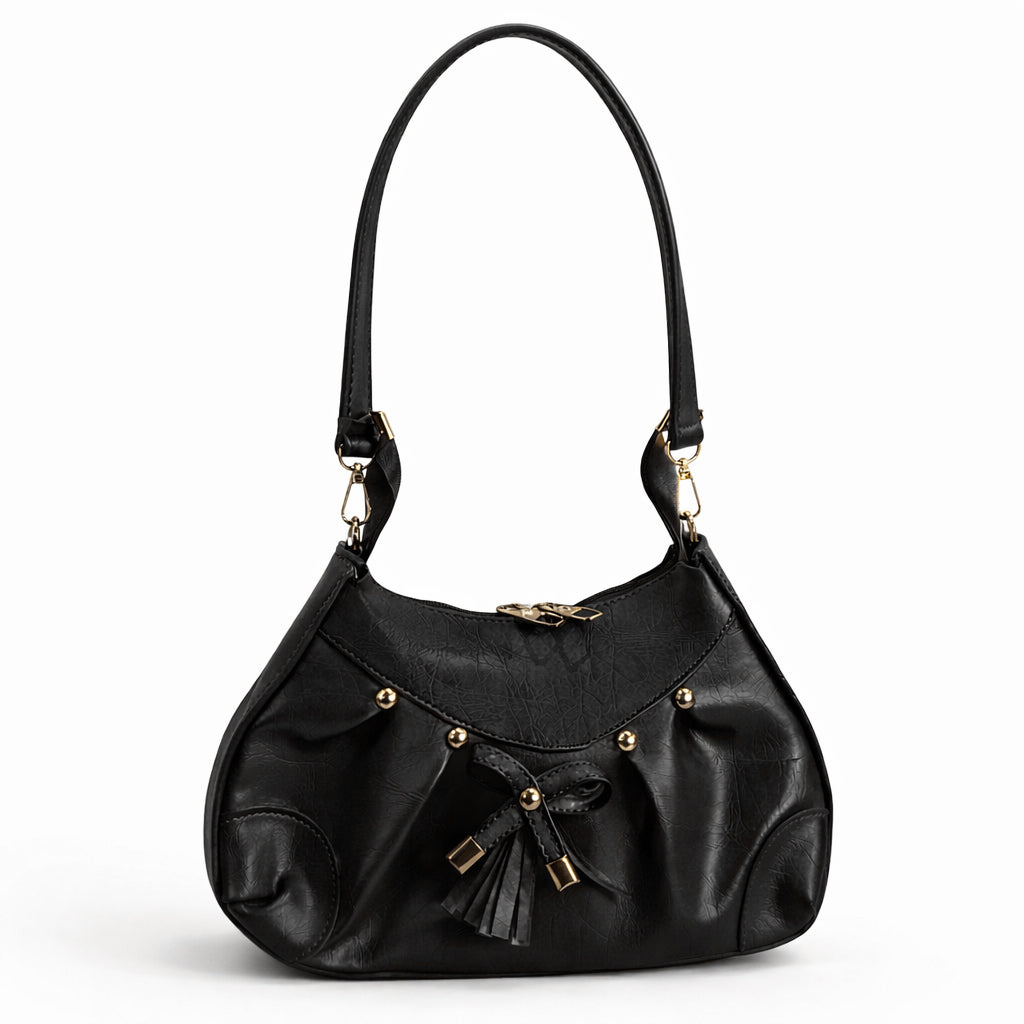 Stylish women's shoulder bag with a pleated design, featuring a bow and tassel – made of soft leather with a modern look, suitable for both formal and casual occasions.