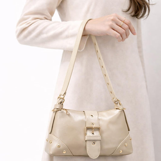 Small  women’s shoulder bag with an elegant leather buckle, featuring a top zipper and a long strap – suitable for daily outings and evening events.