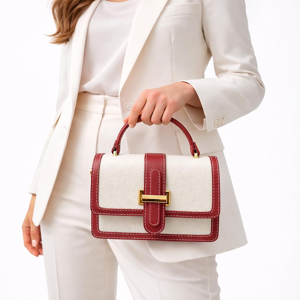 Red leather women’s handbag with a distinctive design, featuring a gold metal buckle and a top handle — suitable for work and special occasions.