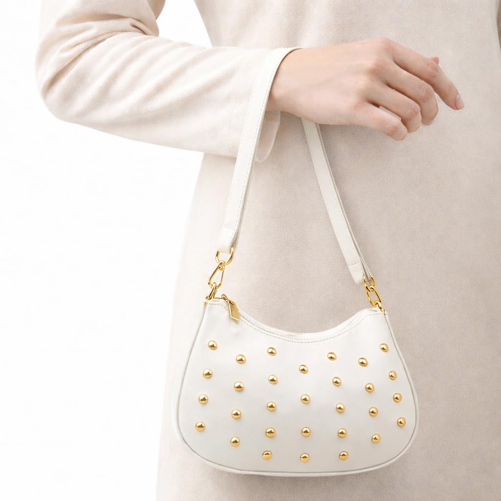 Small women’s shoulder bag decorated with gold studs, featuring a top zipper and a comfortable strap – suitable for outings and evening events.