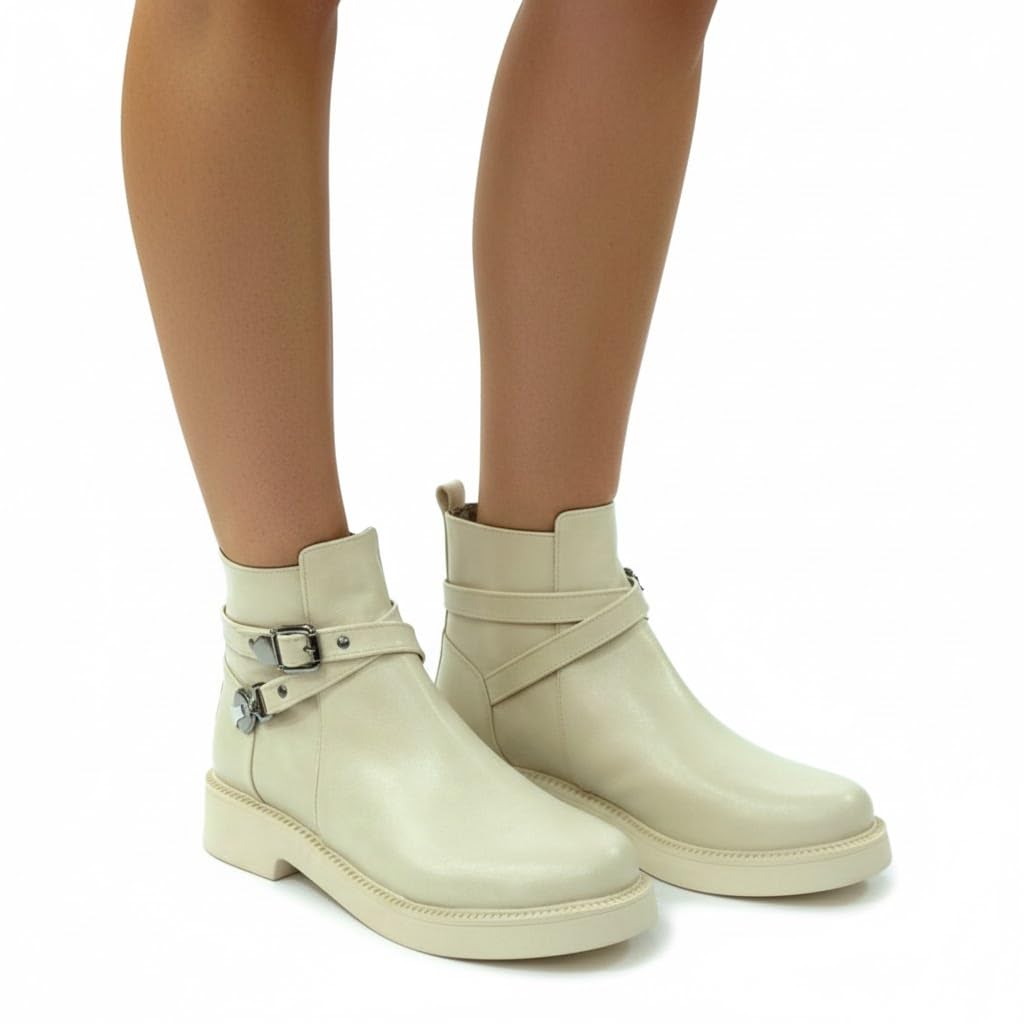 Stylish women's boots with a comfortable heel and elegant design, featuring metal straps.