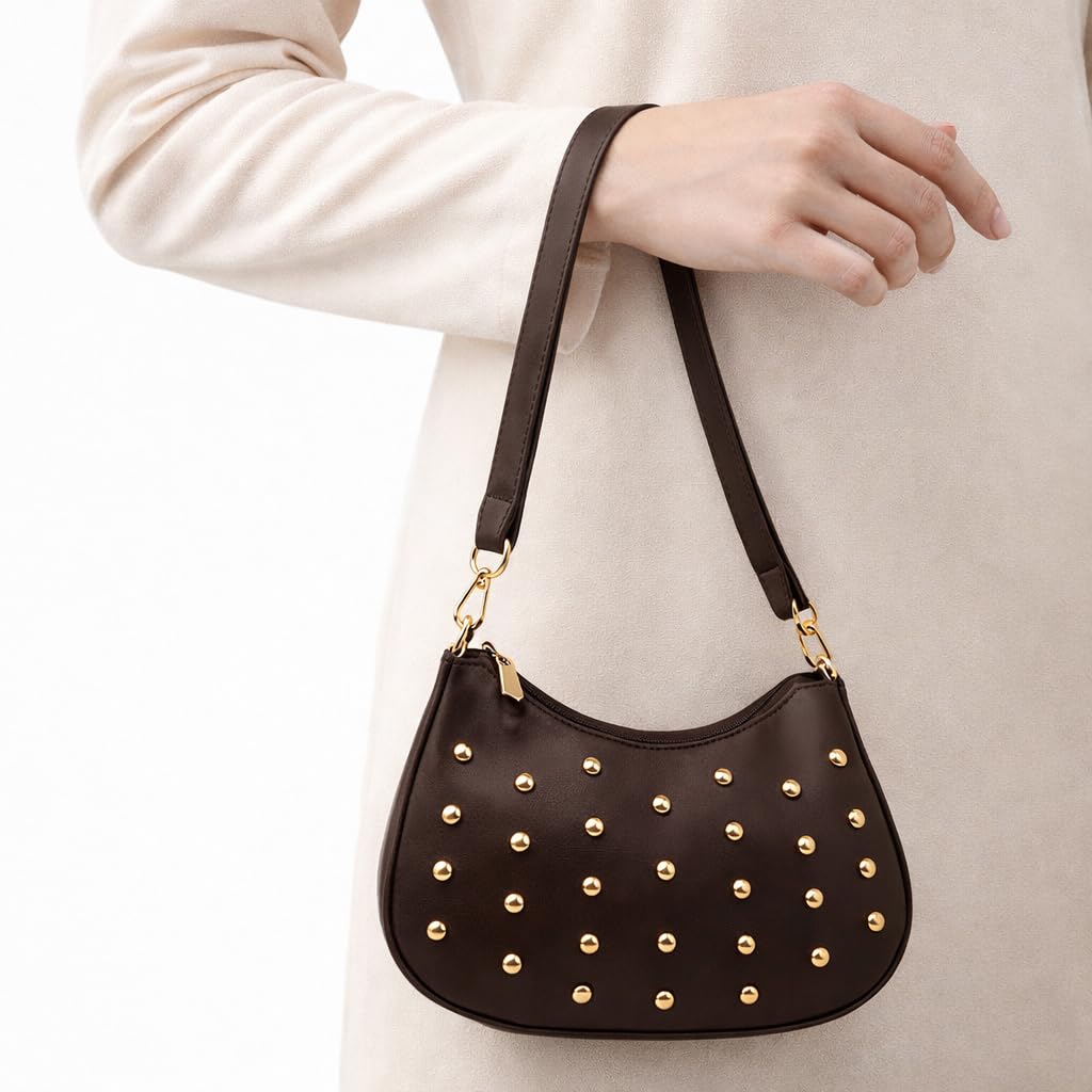 Small women’s shoulder bag decorated with gold studs, featuring a top zipper and a comfortable strap – suitable for outings and evening events.