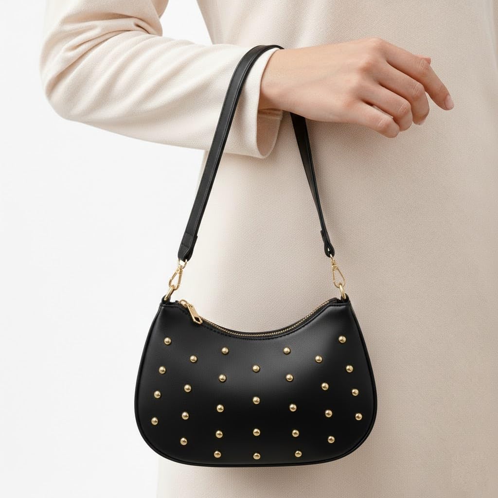 Small women’s shoulder bag decorated with gold studs, featuring a top zipper and a comfortable strap – suitable for outings and evening events.