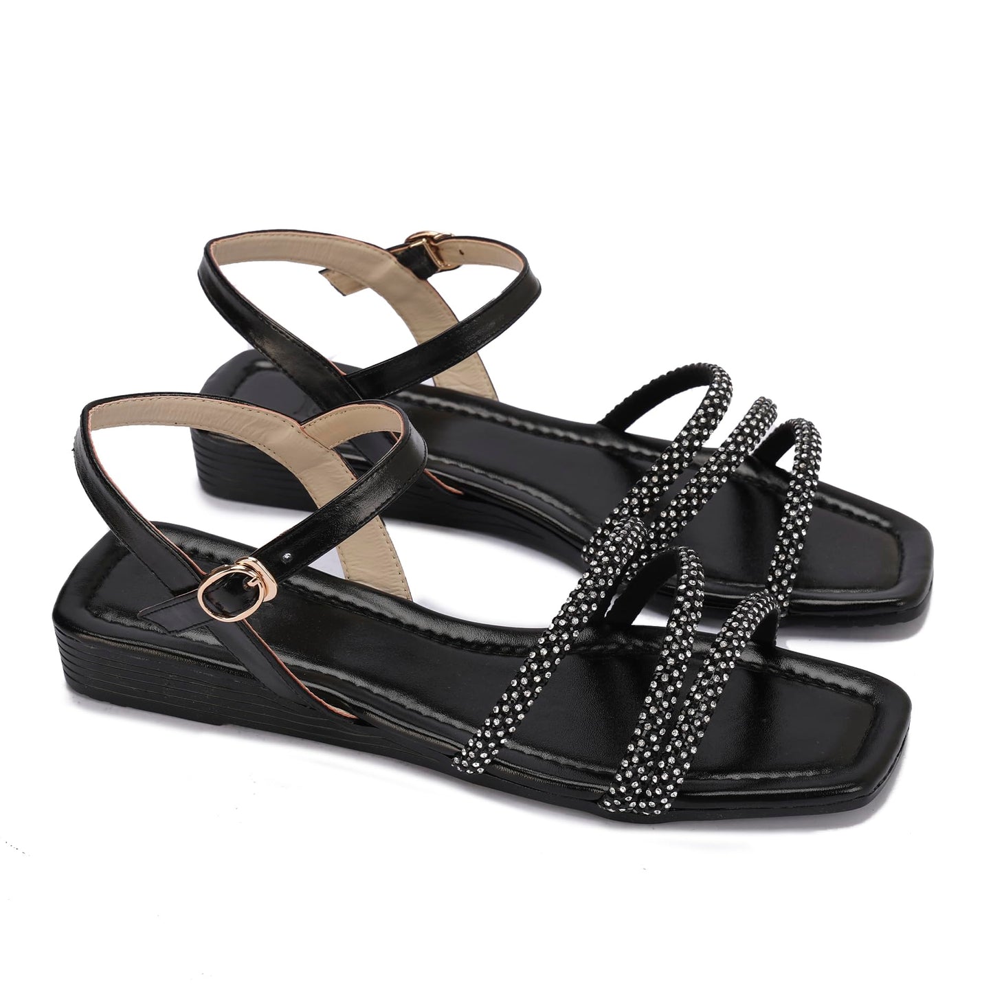 Elegant women's sandals with thin, embellished straps and a buckle design.