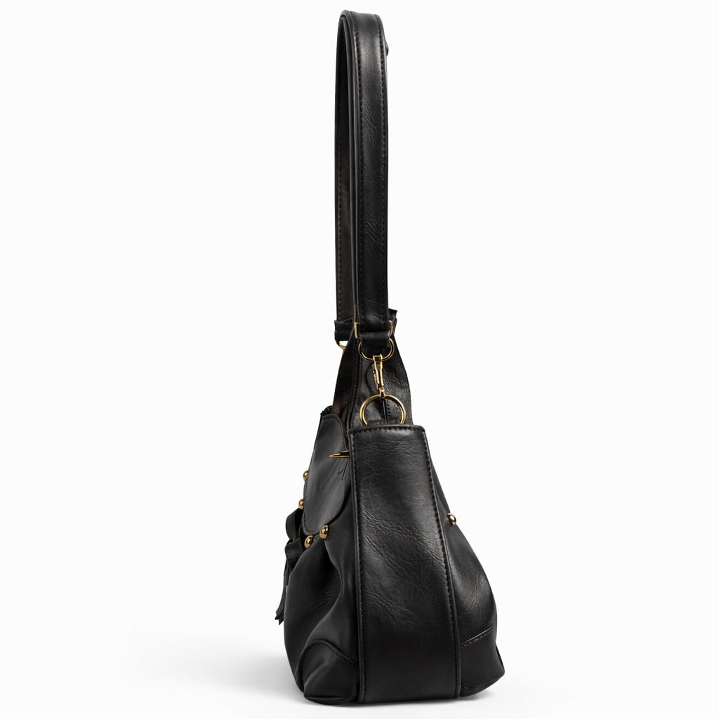 Stylish women's shoulder bag with a pleated design, featuring a bow and tassel – made of soft leather with a modern look, suitable for both formal and casual occasions.