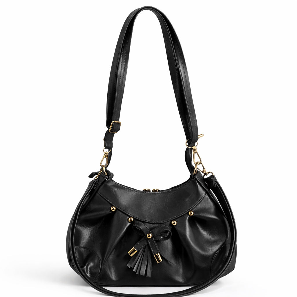 Stylish women's shoulder bag with a pleated design, featuring a bow and tassel – made of soft leather with a modern look, suitable for both formal and casual occasions.