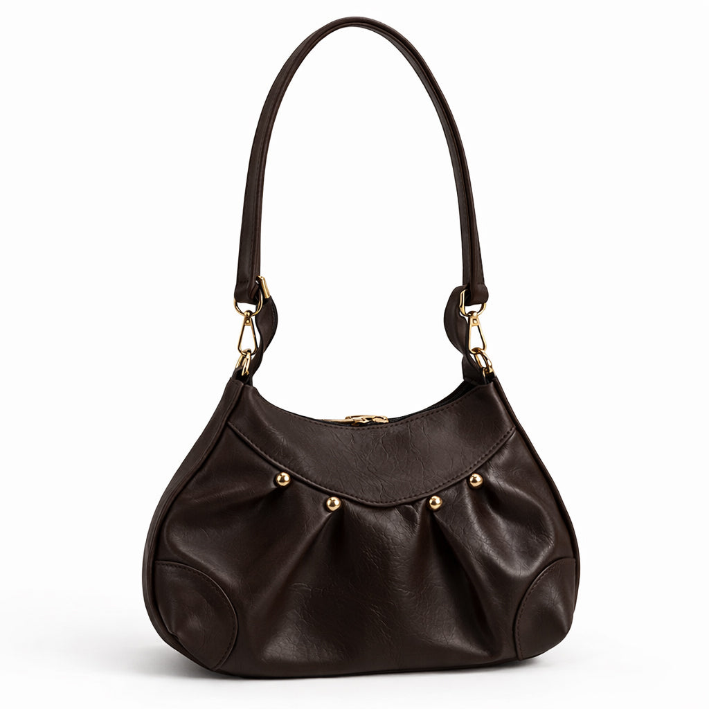 Stylish women's shoulder bag with a pleated design, featuring a bow and tassel – made of soft leather with a modern look, suitable for both formal and casual occasions.
