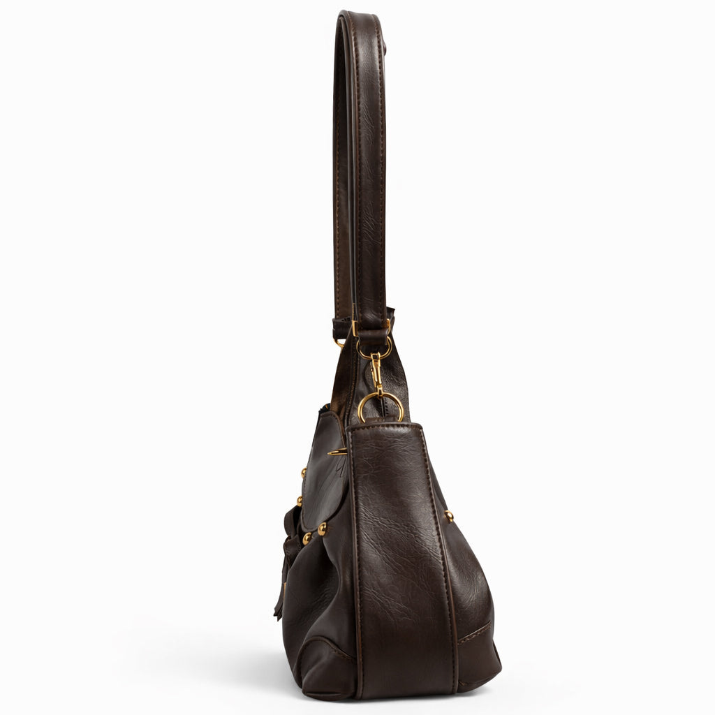Stylish women's shoulder bag with a pleated design, featuring a bow and tassel – made of soft leather with a modern look, suitable for both formal and casual occasions.
