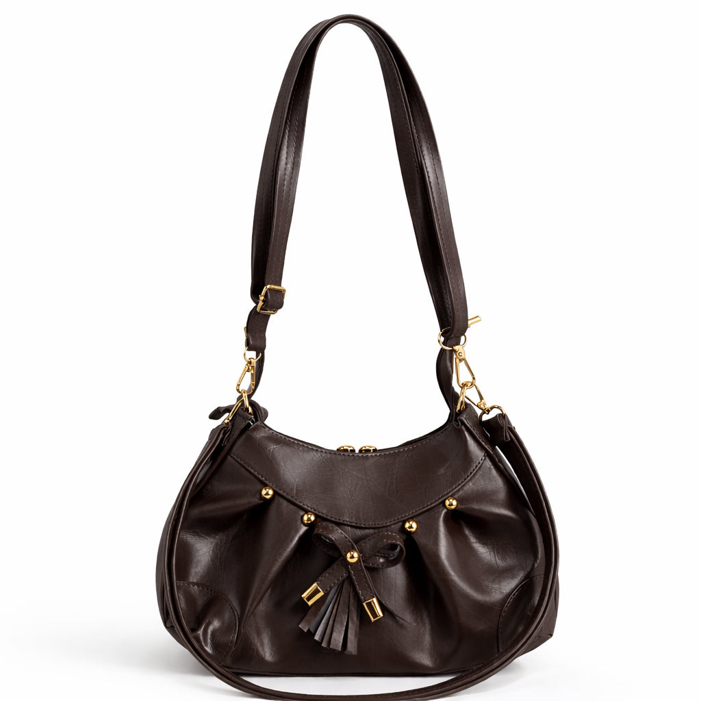Stylish women's shoulder bag with a pleated design, featuring a bow and tassel – made of soft leather with a modern look, suitable for both formal and casual occasions.