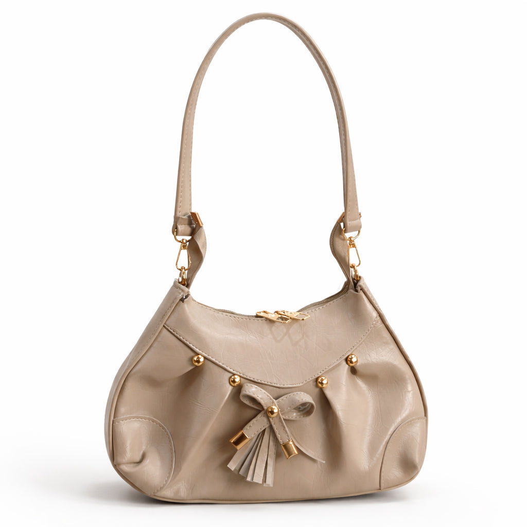 Stylish women's shoulder bag with a pleated design, featuring a bow and tassel – made of soft leather with a modern look, suitable for both formal and casual occasions.