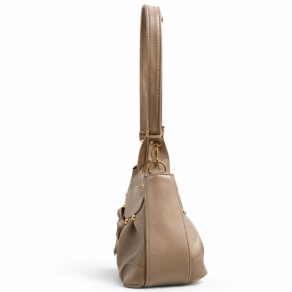 Stylish women's shoulder bag with a pleated design, featuring a bow and tassel – made of soft leather with a modern look, suitable for both formal and casual occasions.
