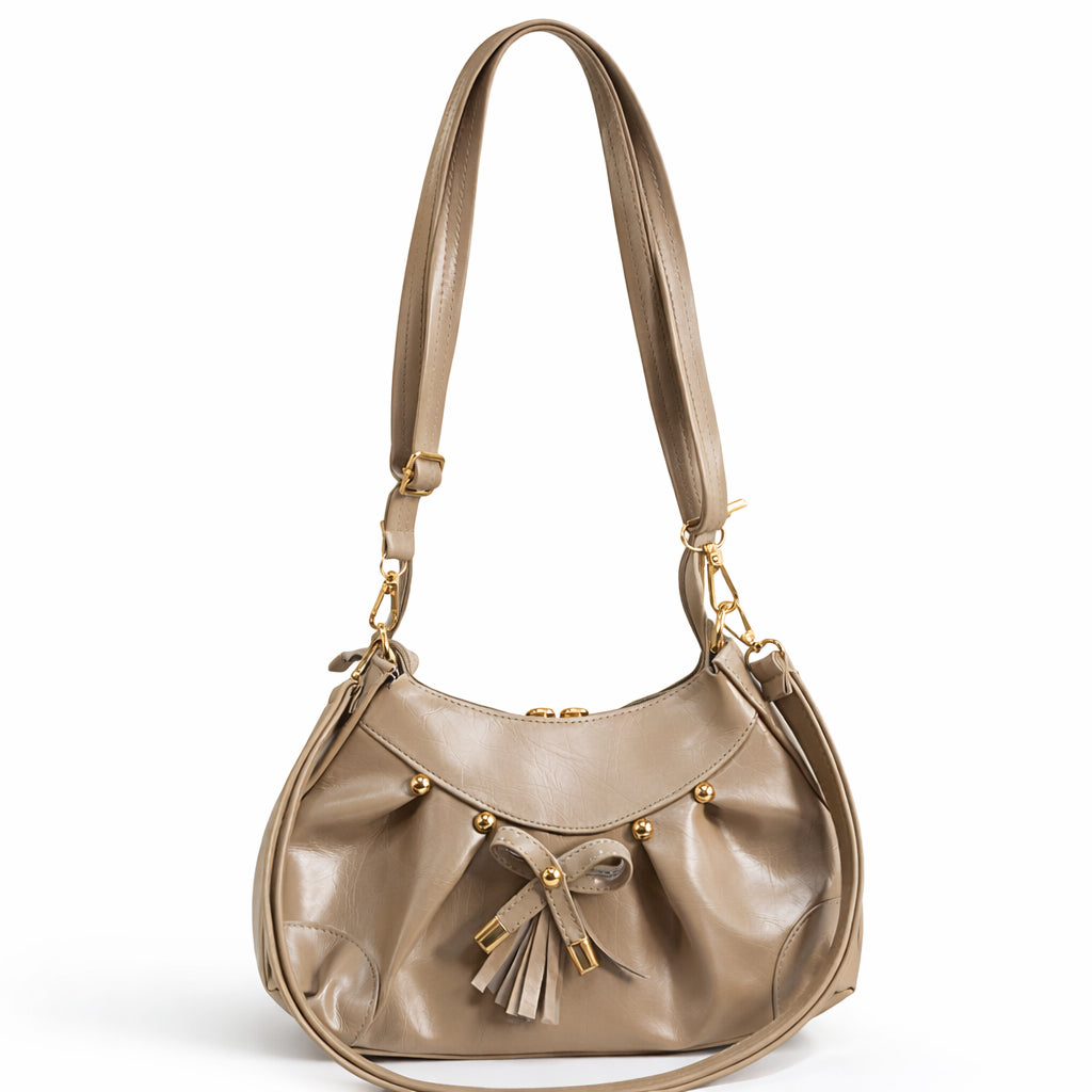 Stylish women's shoulder bag with a pleated design, featuring a bow and tassel – made of soft leather with a modern look, suitable for both formal and casual occasions.