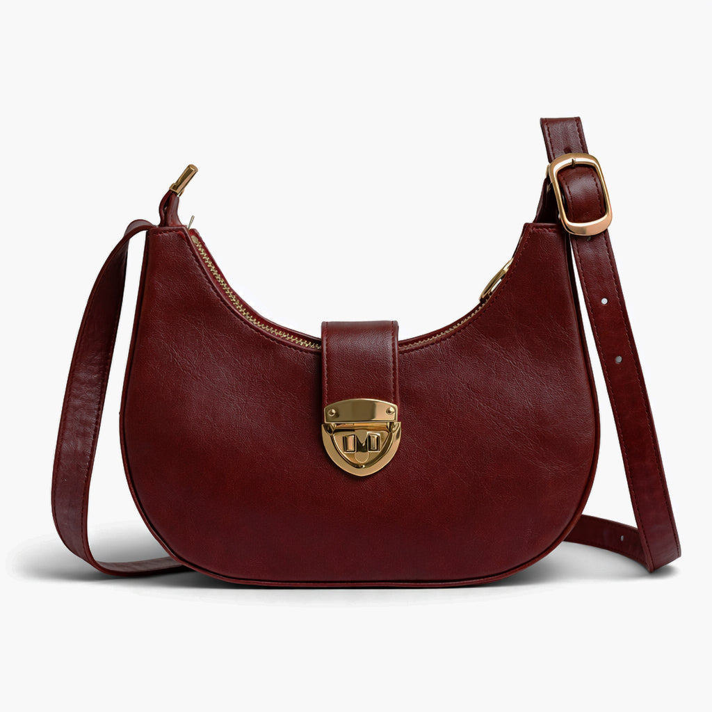A stylish women's shoulder bag with a design that combines elegance and practicality, featuring a distinctive gold clasp and an adjustable strap.