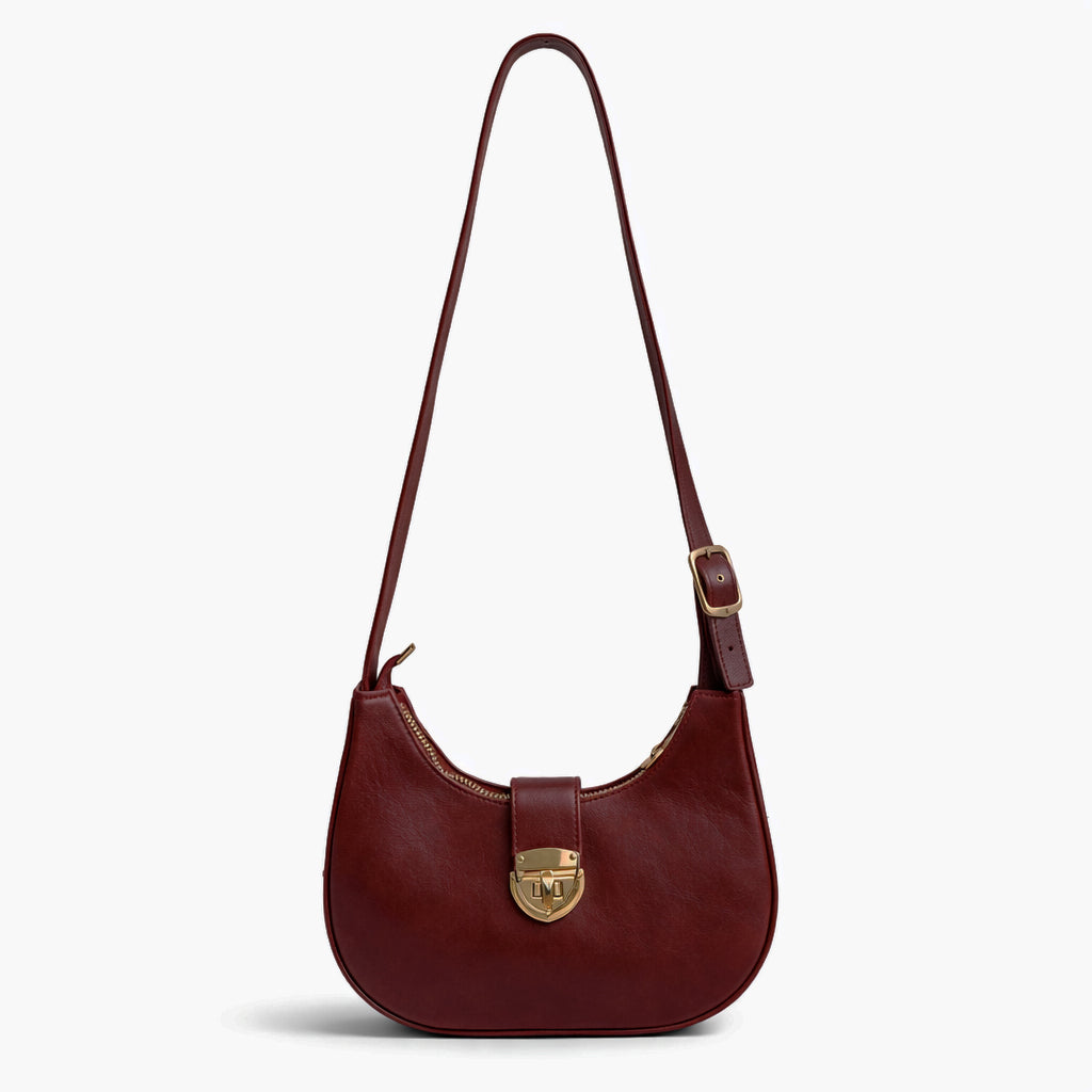 A stylish women's shoulder bag with a design that combines elegance and practicality, featuring a distinctive gold clasp and an adjustable strap.