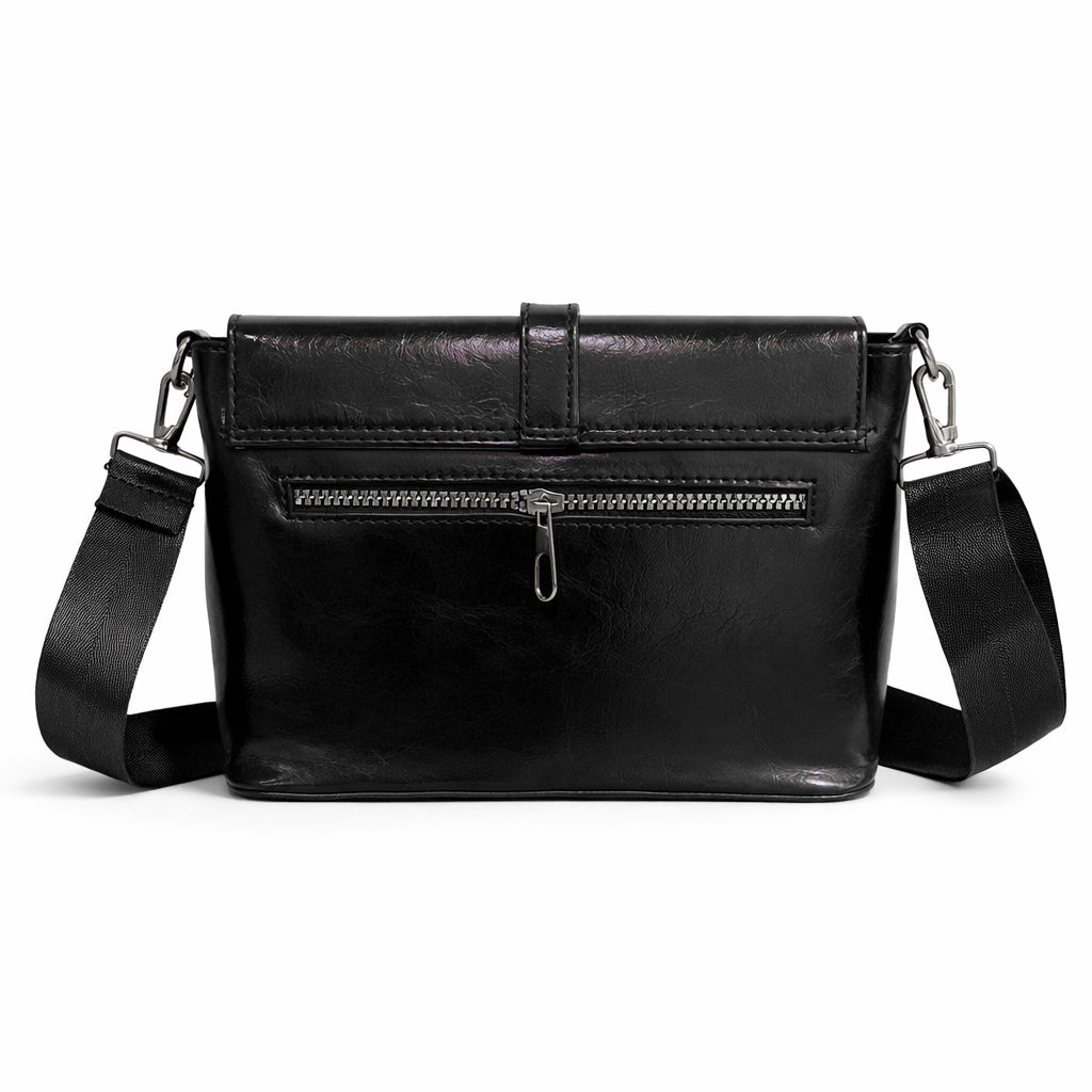 A classic women's crossbody bag in premium leather, featuring a stylish flap design, a distinctive silver metal clasp, and a wide, adjustable strap.
