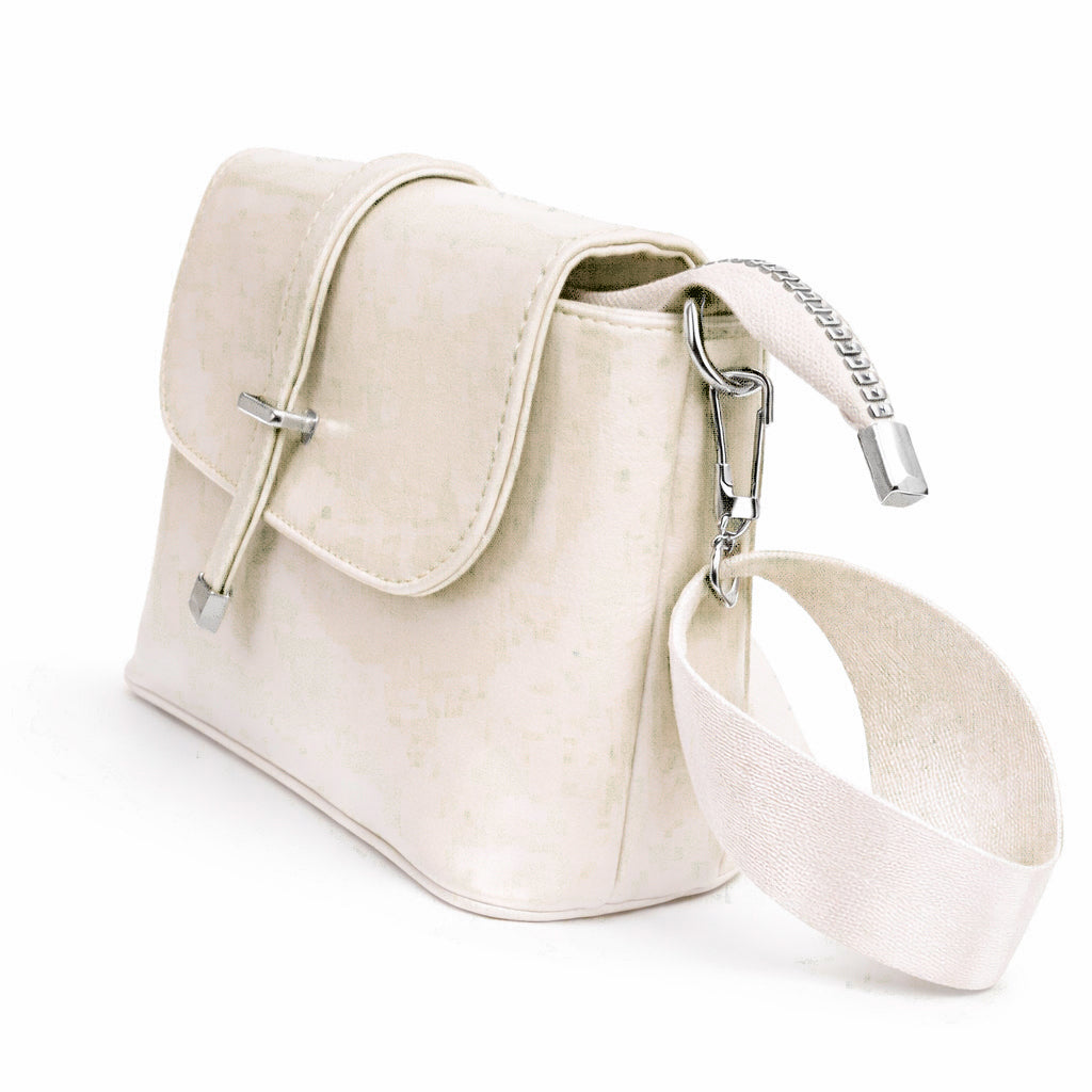 A classic women's crossbody bag in premium leather, featuring a stylish flap design, a distinctive silver metal clasp, and a wide, adjustable strap.