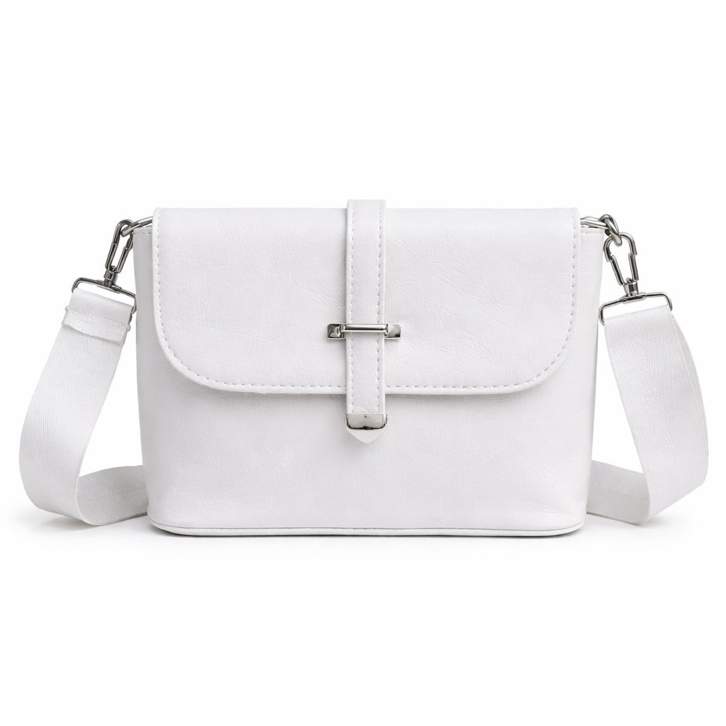 A classic women's crossbody bag in premium leather, featuring a stylish flap design, a distinctive silver metal clasp, and a wide, adjustable strap.