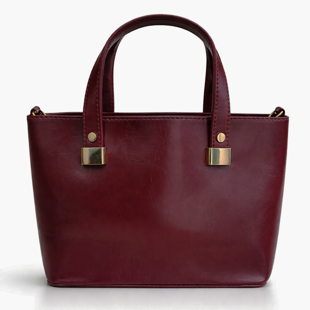 A classic women's small "tote" handbag in glossy leather - equipped with top handles and a wide, adjustable, detachable shoulder strap - stylish and practical for work and occasions.