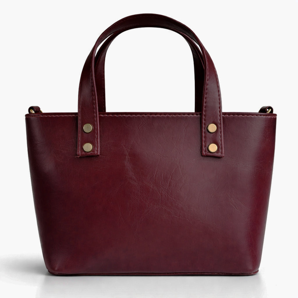 A classic women's small "tote" handbag in glossy leather - equipped with top handles and a wide, adjustable, detachable shoulder strap - stylish and practical for work and occasions.