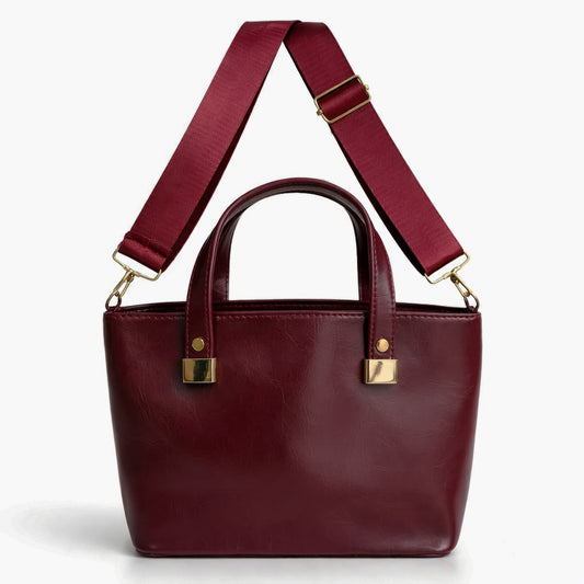 A classic women's small "tote" handbag in glossy leather - equipped with top handles and a wide, adjustable, detachable shoulder strap - stylish and practical for work and occasions.