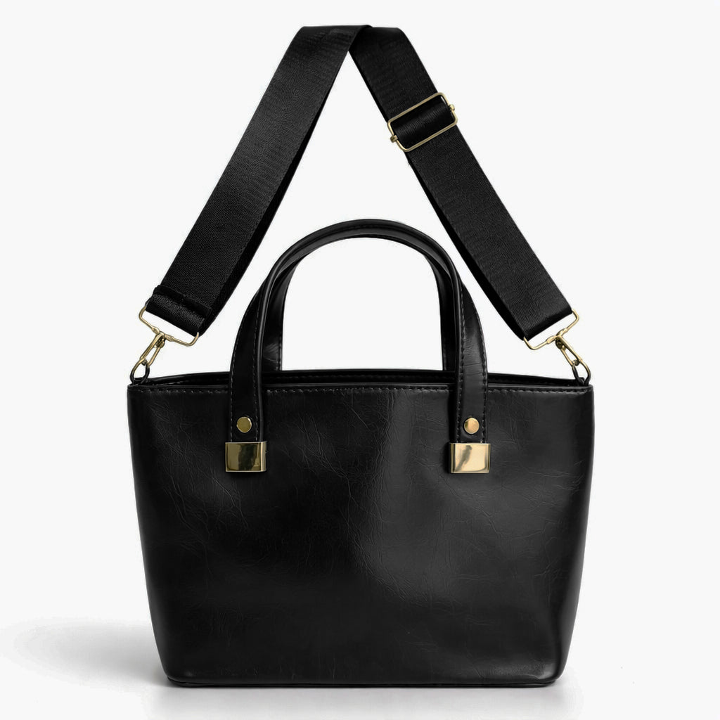 A classic women's small "tote" handbag in glossy leather - equipped with top handles and a wide, adjustable, detachable shoulder strap - stylish and practical for work and occasions.
