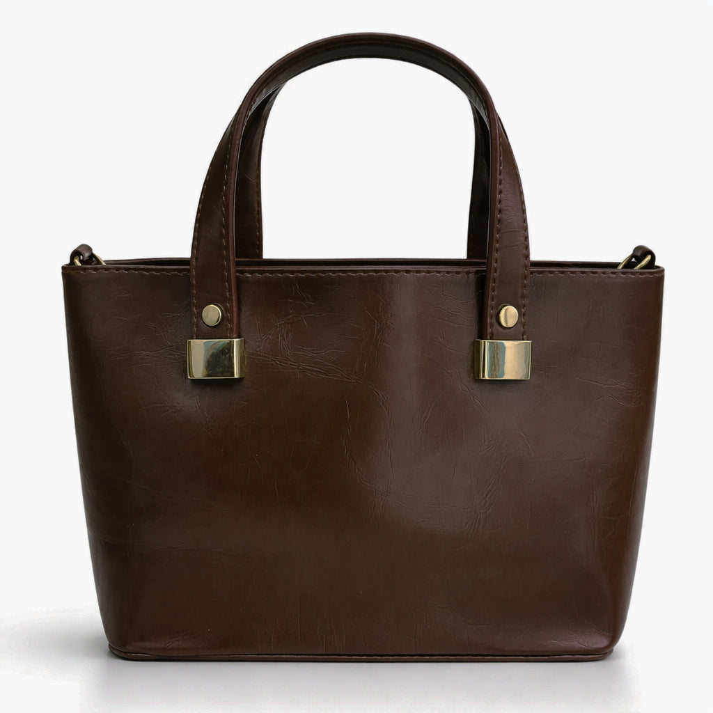 A classic women's small "tote" handbag in glossy leather - equipped with top handles and a wide, adjustable, detachable shoulder strap - stylish and practical for work and occasions.