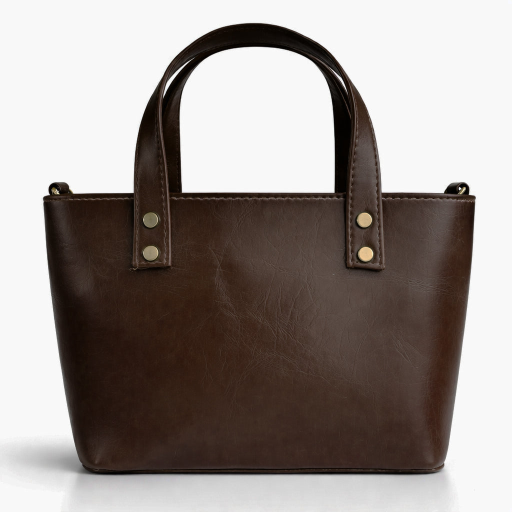 A classic women's small "tote" handbag in glossy leather - equipped with top handles and a wide, adjustable, detachable shoulder strap - stylish and practical for work and occasions.