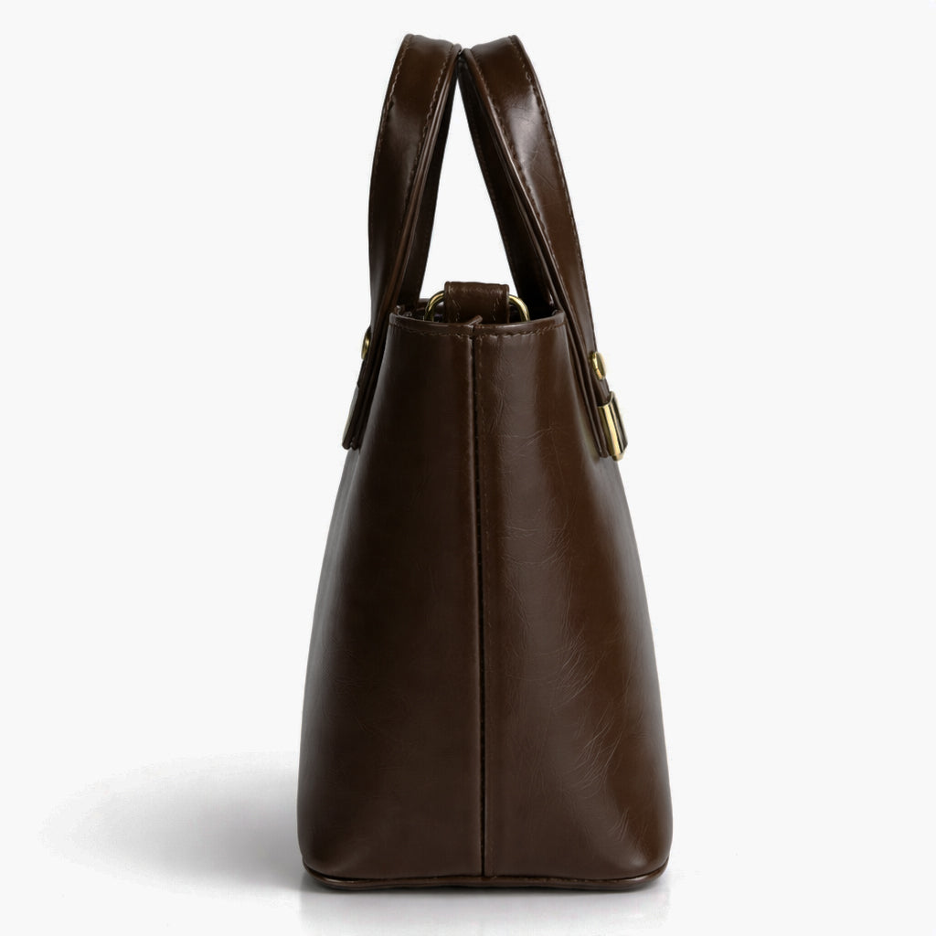 A classic women's small "tote" handbag in glossy leather - equipped with top handles and a wide, adjustable, detachable shoulder strap - stylish and practical for work and occasions.