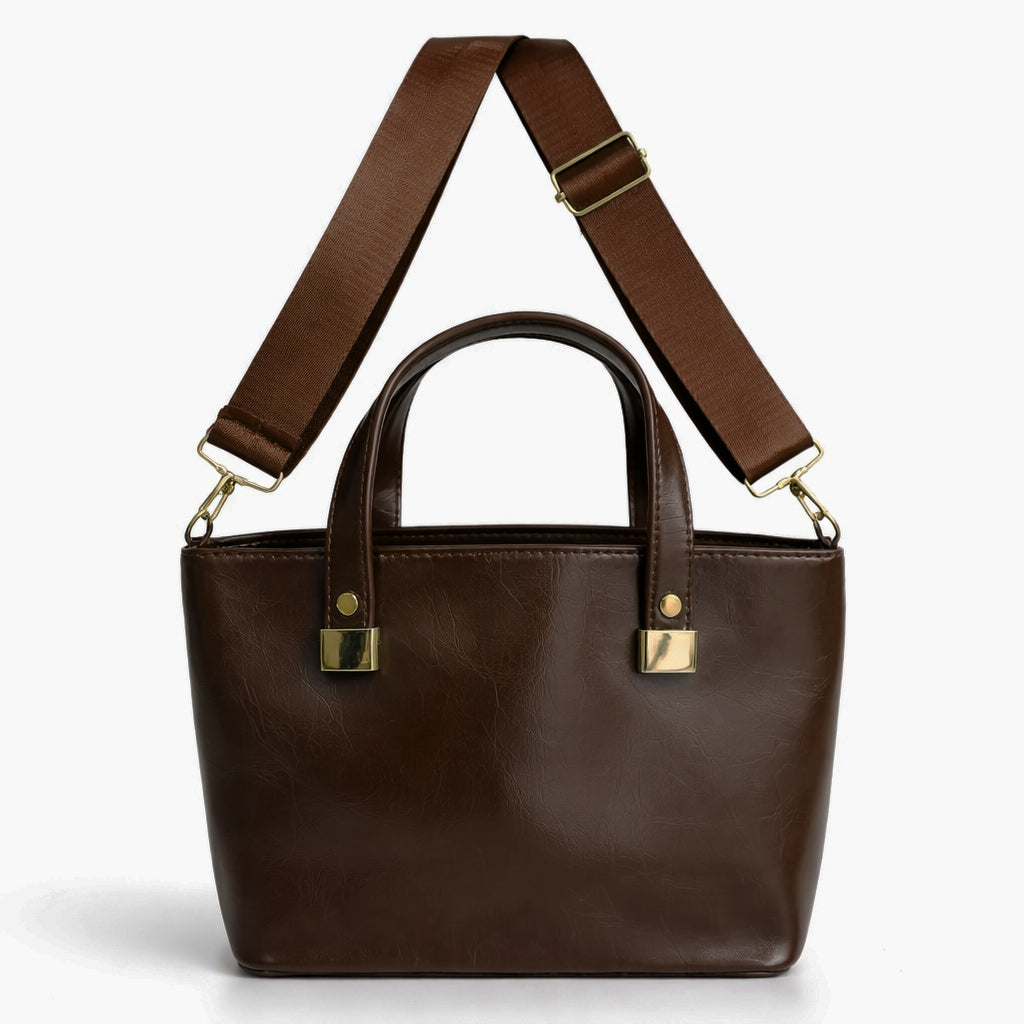 A classic women's small "tote" handbag in glossy leather - equipped with top handles and a wide, adjustable, detachable shoulder strap - stylish and practical for work and occasions.